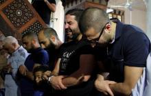 Relatives of the victims of the missing EgyptAir flight MS804 hold an absentee funeral prayer in a mosque nearby Cairo airport, in Cairo Egypt, May 20, 2016. PHOTO BY REUTERS/Stringer