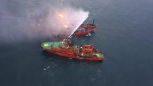 An aerial view shows a rescue vessel during a fire-fighting operation following an accident involving two ships, which caught fire in the Kerch Strait, near the coast of Crimea, January 22, 2019. PHOTO BY REUTERS/Russia's Ministry for Civil Defence, Emergencies and Elimination of Consequences of Natural Disasters