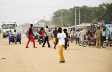 South Sudanese residents walk along a street of Bor, in Jonglei state, December 10, 2014. PHOTO BY REUTERS/Jok Solomon