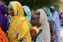 Residents queue for blankets and food distributed by Nigerien soldiers in Damask, March 24, 2015. PHOTO BY REUTERS/Joe Penney