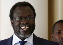 South Sudan's rebel leader Riek Machar smiles as he meets his friends at Sheraton Hotel in Addis Ababa