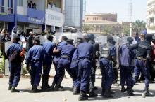 Riot police hold their position as they attempt to disperse supporters of Democratic Republic of Congo's opposition Presidential candidate Moise Katumbi as they escort him to the prosecutor's office over government allegations he hired mercenaries in a plot against the state in Lubumbashi, the capital of Katanga province, May 13, 2016. PHOTO BY REUTERS/Kenny Katombe