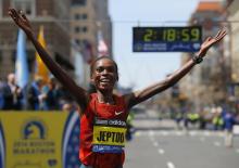 Kenya's Rita Jeptoo reacts after winning the women's division at the 118th running of the Boston Marathon in Boston, Massachusetts April 21, 2014. PHOTO BY REUTERS/Brian Snyder