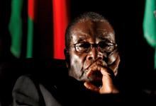 Zimbabwean President Robert Mugabe watches a video presentation during the summit of the Southern African Development Community (SADC) in Johannesburg, South Africa, August 17, 2008. PHOTO BY REUTERS/Mike Hutchings