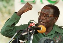 Zimbabwean President Robert Mugabe speaks at an election rally in Bindura, April 2000. REUTERS/Howard Burditt