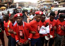 Ugandan musician turned politician, Robert Kyagulanyi (C) leads activists during a demonstration against new taxes including a levy on access to social media platforms in Kampala, Uganda July 11, 2018. PHOTO BY REUTERS/Newton Na