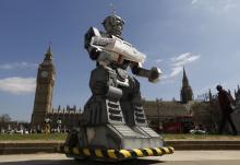 A robot is pictured in front of the Houses of Parliament and Westminster Abbey as part of the Campaign to Stop Killer Robots in London, April 23, 2013. PHOTO BY REUTERS/Luke MacGregor