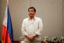 Philippines 'President Rodrigo Duterte stands at attention during a courtesy call with the Association of Southeast Asian Nations (ASEAN) Economic Ministers in Manila, Philippines, September 6, 2017. PHOTO BY REUTERS/Pool/Mark Cristino