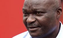 Former Cameroon soccer player Roger Milla attends a news conference during his meeting with young Kenyan players in the capital Nairobi, May 10, 2010. PJOYO BY REUTERS/Noor Khamis