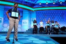 Rohan Raja, 13, of Irving, Texas, spells the last word in competition as the remaining competitors celebrate an eight way tie in the final round of the 92nd annual Scripps National Spelling Bee at National Harbor in Oxon Hill, Maryland, U.S., May 31, 2019. PHOTO BY REUTERS/Joshua Roberts