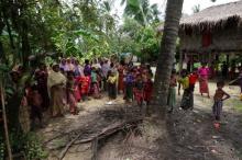 Rohingya villagers watch as international media visit Maung Hna Ma village, Buthidaung township, northern Rakhine state, Myanmar, July 14, 2017. PHOTO BY REUTERS/Simon Lewis