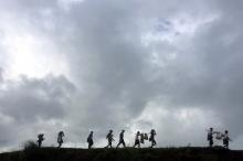 People displaced by violence walk in the banks of Mayu river with their belongings while moving to another village, in Buthidaung in the north of Rakhine state, Myanmar, September 13, 2017. PHOTO BY REUTERS/Stringer