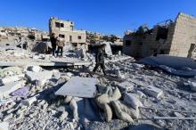 People inspect a site hit by what residents said were airstrikes carried out by the Russian air force in the town of Turmanin, in Idlib Governorate near the Syrian-Turkish border, January 25, 2016. PHOTO BY REUTERS/Ammar Abdullah