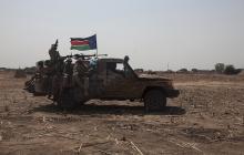 SPLA soldiers drive to the frontline at Mathiang from their military base in Bor, South Sudan