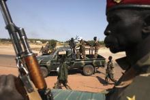 SPLA soldiers get off of a pick-up truck in Bentiu, Unity state, January 12, 2014. PHOTO BY REUTERS/Andreea Campeanu