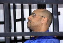 Saif al-Islam Gaddafi, son of late Libyan leader Muammar Gaddafi, attends a hearing behind bars in a courtroom in Zintan, May 25, 2014. PHOTO BY REUTERS/Stringer