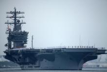 Sailors man the rails as aircraft carrier USS Nimitz with Carrier Strike Group 11, and some 7,500 sailors and airmen depart for a 6 month deployment in the Western Pacific from San Diego, California, U.S., June 5, 2017. PHOTO BY REUTERS/Mike Blake