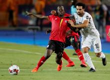 Egypt's Mohamed Salah in action with Uganda's Faruku Miya. PHOTO BY REUTERS/Amr Abdallah Dalsh