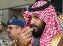 Saudi Arabia's Crown Prince Mohammed bin Salman drinks coffee during the graduation ceremony of the 93rd batch of the cadets of King Faisal Air Academy, in Riyadh, Saudi Arabia, February 21, 2018. PHOTO BY REUTERS/Bandar Algaloud/Courtesy of Saudi Royal Court