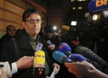 Deputy director Jean Marc Grenier talks to media outside the CHU Nord hospital in Grenoble, French Alps, where retired seven-times Formula One world champion Michael Schumacher is hospitalized after a ski accident