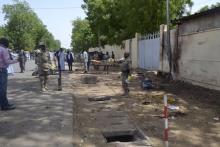 Security officers secure the site of a suicide bombing in Ndjamena, Chad, June 15, 2015. At least 27 people, including four suspected Boko Haram Islamist fighters, were killed and 100 others were injured on Monday in two attacks in Chad's capital, N'Djamena. PHOTO BY REUTERS/Moumine Ngarmbassa