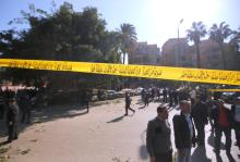 Security officials and investigators inspect the scene of a bomb blast in Giza Al Haram Street on the outskirts of Cairo, Egypt December 9, 2016. Yellow barrier tape reads, "Do not approach criminal lab." PHOTO BY REUTERS/Amr Abdallah Dalsh