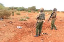 A Kenyan security person stands at the scene where a blast killed Kenyan police officers at the Garissa county, eastern Kenya, May 24, 2017. PHOTO BY REUTERS/Stringer