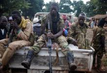 Seleka fighters take a break as they sit on a pick-up truck in the town of Goya, June 11, 2014. PHOTO BY REUTERS/Goran Tomasevic