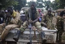 Seleka fighters take a break as they sit on a pick-up truck in the town of Goya