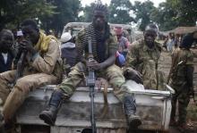 Seleka fighters take a break as they sit on a pick-up truck in the town of Goya, June 11, 2014. PHOTO BY REUTERS/Goran Tomasevic