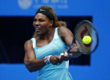 Serena Williams of the U.S. returns the ball during her women's singles match against Silvia Soler-Espinosa of Spain at the China Open tennis tournament in Beijing