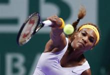 Serena Williams of the U.S. hits a return to Li Na of China during their WTA tennis championships final match at Sinan Erdem Dome in Istanbul