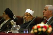 Egyptian-born cleric Sheikh Youssef al-Qaradawi (C) attends the opening session of the fifth International Al-Quds conference in Algiers