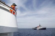 Migrant Offshore Aid Station (MOAS) founder Regina Catrambone of Italy watches as the MOAS ship MV Phoenix sails outside Valletta's Grand Harbour, Malta, May 2, 2015. PHOTO BY REUTERS/Darrin Zammit Lupi