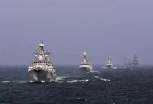 Chinese and Russian naval vessels participate in the Joint Sea-2014 naval drill outside Shanghai on the East China Sea, May 24, 2014. PHOTO BY REUTERS/China Daily