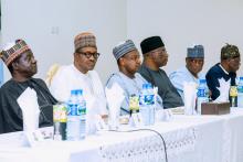 Nigeria's President Muhammadu Buhari sits with Plateau State governor Simon Lalong and officials during his visit to Plateau State, Nigeria in this handout picture released on June 26, 2018. PHOTO BY REUTERS/Courtesy of Nigeria Presidency