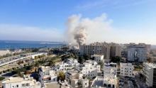 Smoke rises from the Libyan foreign ministry building in Tripoli, Libya December 25, 2018, in this still image obtained from a social media video. PHOTO BY REUTERS/Youtube/Mohammed Elgotani