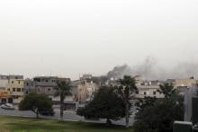 Smoke rises over the General National Congress building in Tripoli