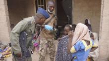 A soldier from the Nigerian Army talks with hostage women and children who were freed from Boko Haram, in Yola, in this April 29, 2015 handout. PHOTO BY REUTERS/Nigerian Military