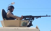 An Egyptian army soldier looks on from his postion at a checkpoint in Al Arish city, in the troubled northern part of the Sinai peninsula, July 8, 2015. PHOTO BY REUTERS/Stringer