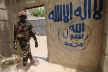 A Nigerien soldier walks out of a house that residents say a Boko Haram militant had forcefully seized and occupied in Damask, March 24, 2015. PHOTO BY REUTERS/Joe Penney