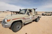 A Libyan soldier sits in a military vehicle at checkpoint in Wadi Bey, west of the Islamic State-held city of Sirte, February 23, 2016. PHOTO BY REUTERS/Ismail Zitouny