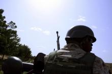 A soldier from Niger escorts U.S. soldiers back to their base following an anti-Boko Haram summit in Diffa city, Niger, September 3, 2015. PHOTO BY REUTERS/Warren Strobel