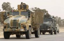 Soldiers patrol during a military operation to eliminate militants in a village some 50 km (31 miles) from the town of Ben Guerdane, Tunisia, near the Libyan border, March 10, 2016. PHOTO BY REUTERS/Zoubeir Souissi