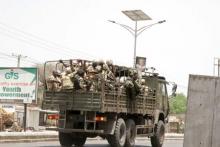 Soldiers are seen on a truck along a road in Maiduguri in Borno State, Nigeria, May 14, 2015. PHOTO BY REUTERS/Stringer