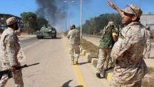 Soldiers from a force aligned with Libya's new unity government walk along a road during an advance on the eastern and southern outskirts of the Islamic State stronghold of Sirte, in this still image taken from video on June 9, 2016. PHOTO BY REUTERS