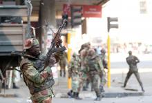 Soldiers open fire to disperse crowds of the opposition Movement for Democratic Change supporters outside the party's headquarters in Harare, Zimbabwe, August 1, 2018. PHOTO BY REUTERS/Mike Hutchings