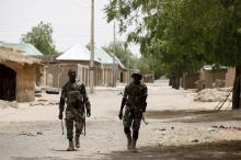 Nigerien soldiers patrol on foot in Damasak. PHOTO BY REUTERS/Joe Penney