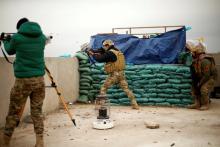 A member of the Iraqi rapid response forces fires during a battle with Islamic State militants at the Tigris river frontline near Mosul, Iraq, January 25, 2017. PHOTO BY REUTERS/Ahmed Jadallah