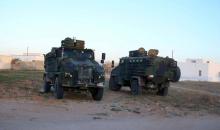 Soldiers patrol after Monday's attack by Islamic State militants on army and police barracks in the town of Ben Guerdan, Tunisia, near the Libyan border, March 9, 2016. PHOTO BY REUTERS/Zoubeir Souissi